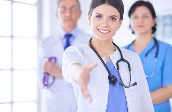 Female doctor offering a handshake in the hospital — Stock Photo, Image