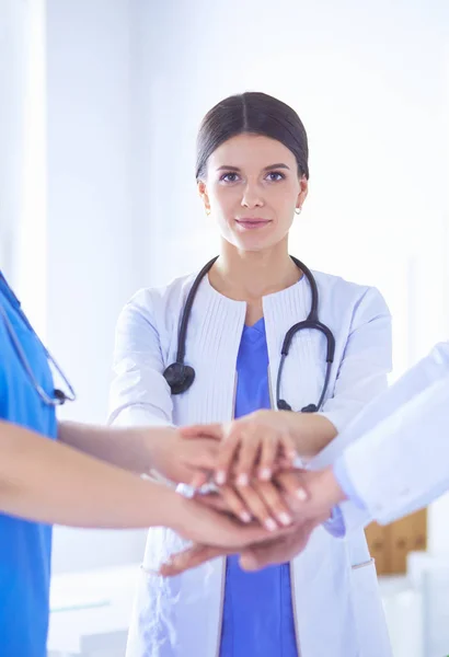 Group of doctors putting their hands together. Close-up — Stock Photo, Image