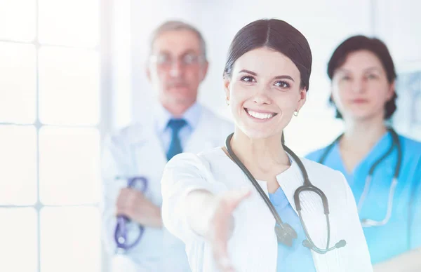 Female doctor offering a handshake in the hospital — Stock Photo, Image