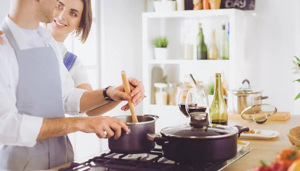 Couple cooking together in the kitchen at home — Stock Photo, Image