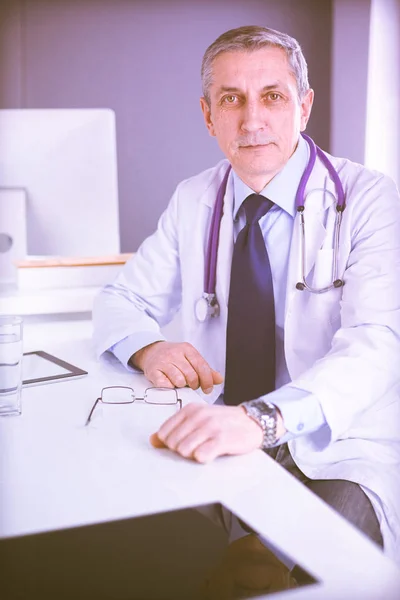 Portrait of a smiling doctor in his bright office — Stock Photo, Image