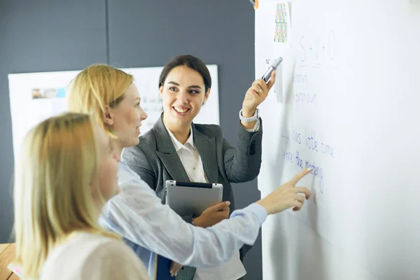 Young people studying with books on desk. Beautiful women and men working together. — Stock Photo, Image