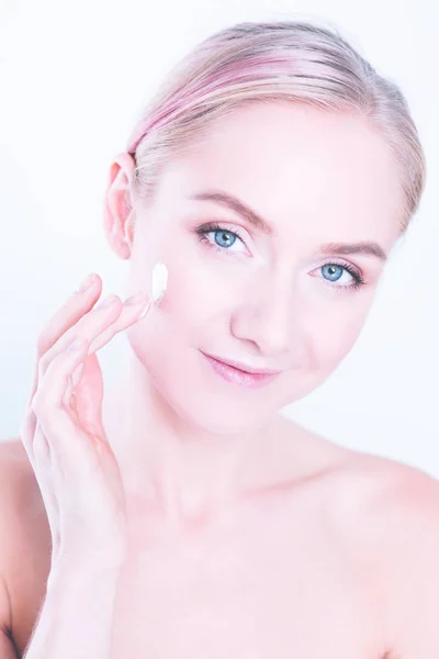 The beautiful young girl with a clean fresh skin touches with a hand a cheek — Stock Photo, Image