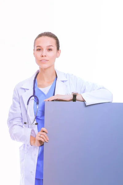 A female doctor with a blank billboard. Woman doctor — Stock Photo, Image