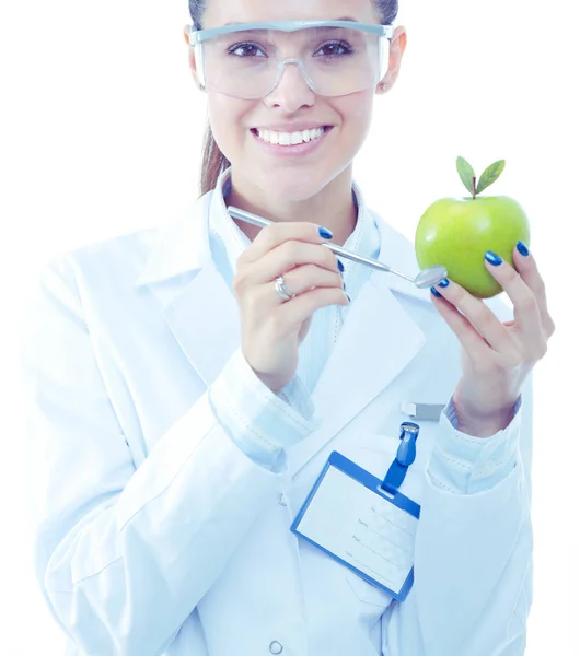 Una dottoressa sorridente con una mela verde. Donna medico — Foto Stock