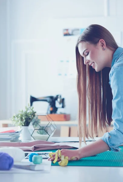 Fashion designer working on her designs in the studio — Stock Photo, Image