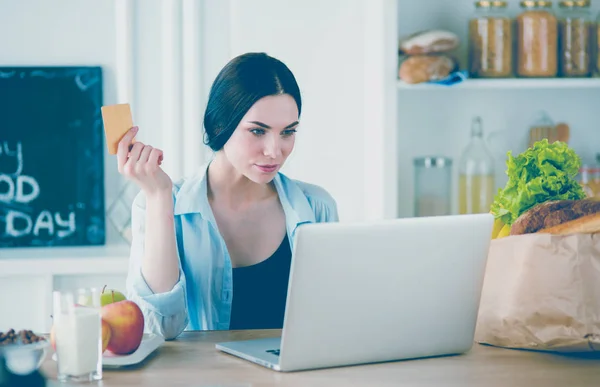 Young woman with her laptop at home — Stock Photo, Image