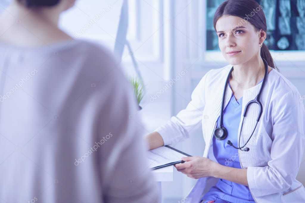 Medical consultation in a hospital. Doctor listening to a patients problems