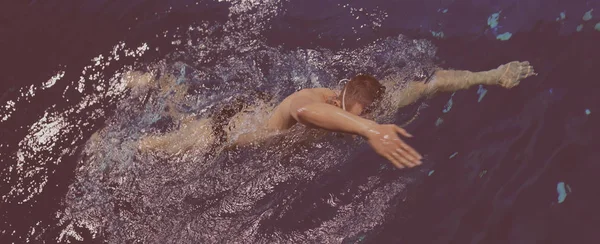 Young man swimming the front crawl in a pool — Stock Photo, Image