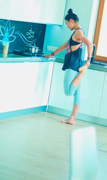 Fitness girl cooking healthy food in the kitchen. Woman. Kitchen. Cooking