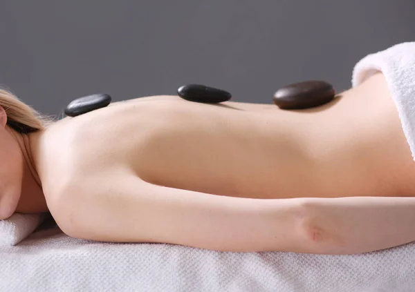 Young woman lying on a massage table,relaxing with eyes closed. Woman. Spa salon — Stock Photo, Image