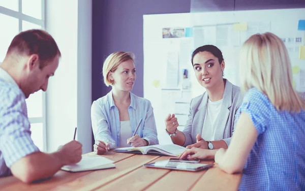 Young people studying with books on desk. Beautiful women and men working together. — Stock Photo, Image