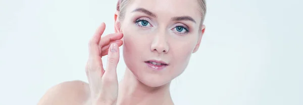 The beautiful young girl with a clean fresh skin touches with a hand a cheek — Stock Photo, Image