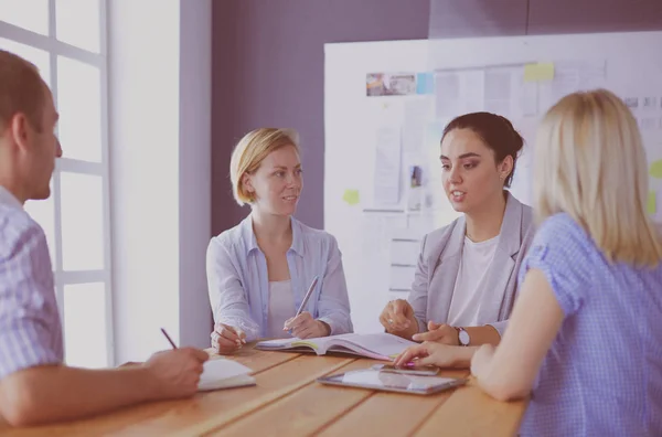 Young people studying with books on desk. Beautiful women and men working together. — Stock Photo, Image