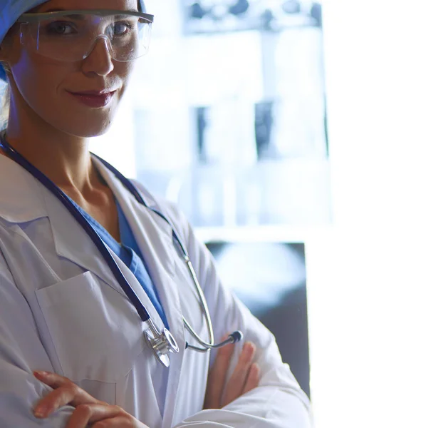 Image of attractive woman doctor looking at x-ray results. — Stock Photo, Image