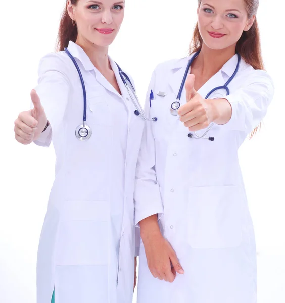 Due giovani dottoressa, in piedi in ospedale. Due giovani donne medico. — Foto Stock