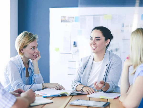 Young people studying with books on desk. Beautiful women and men working together. — Stock Photo, Image