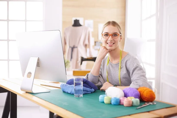 Young entrepreneur women, and fashion designer working on her atelier