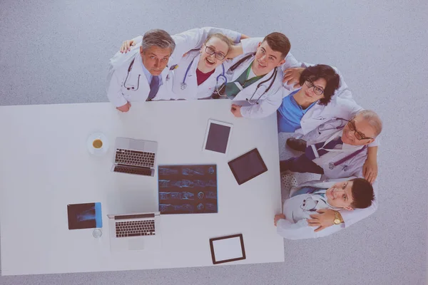 Medical team sitting and discussing at table, top view — Stock Photo, Image