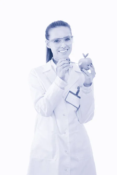 Una dottoressa sorridente con una mela verde. Donna medico. — Foto Stock