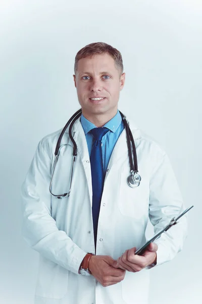 Male doctor standing with folder, isolated on white background — Stock Photo, Image