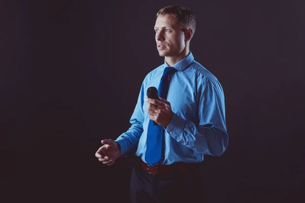 Businessman speech concept, talking with microphone in conference hall — Stock Photo, Image