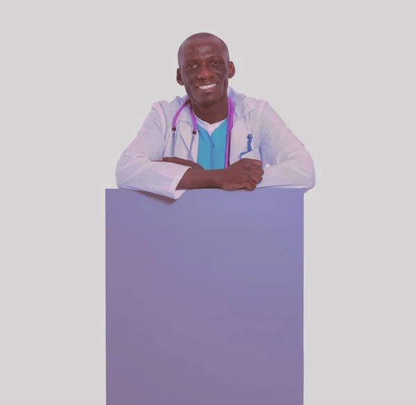 Male doctor holding empty placard. Doctor. Billboard — Stock Photo, Image
