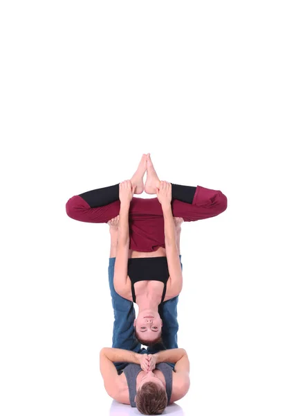 Young athletic couple practicing acroyoga. Balancing in pair. — Stock Photo, Image