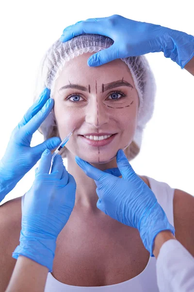 Beautiful woman face near doctor with syringe. — Stock Photo, Image
