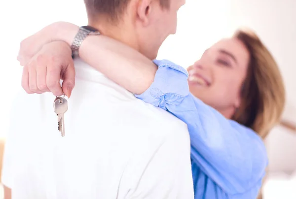 Happy couple hugging in their new house — Stock Photo, Image