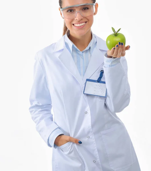 Mulher sorridente doutor com uma maçã verde. Mulher médica — Fotografia de Stock