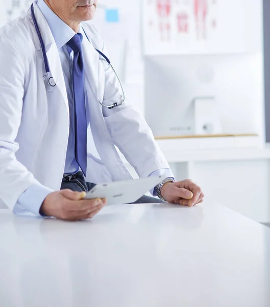 Portrait of a smiling doctor in his bright office — Stock Photo, Image