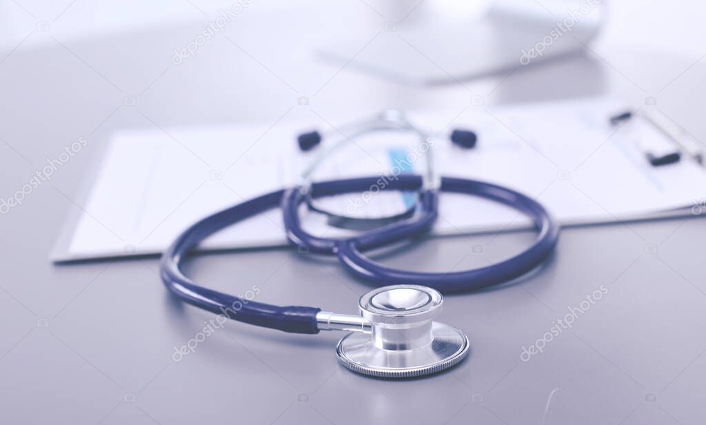 Medical equipment: blue stethoscope and tablet on white background. Medical equipment