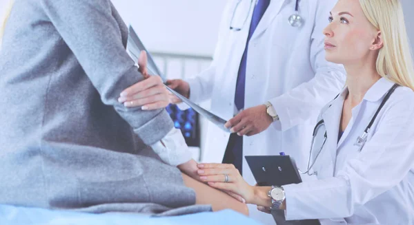 Doctor and patient discussing scan results in diagnostic center