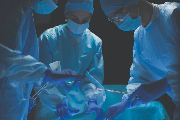 Team surgeon at work in operating room. — Stock Photo, Image