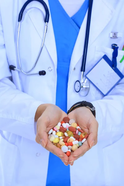 Doctor holding heap of drugs in a hand. Woman doctor — Stock Photo, Image