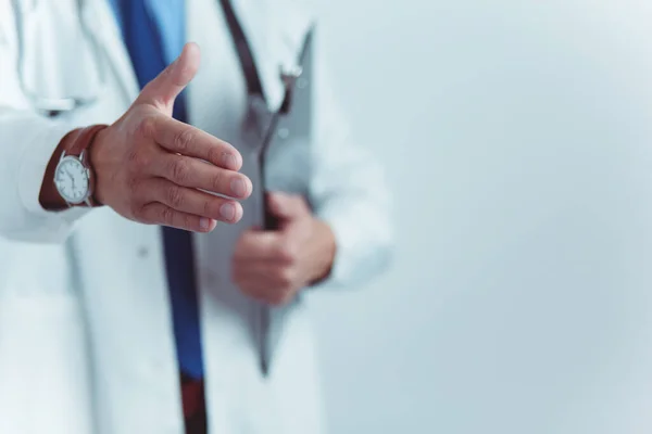 Friendly male doctor with open hand ready for hugging — Stock Photo, Image