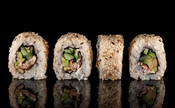 Several sushi california rolls in a row