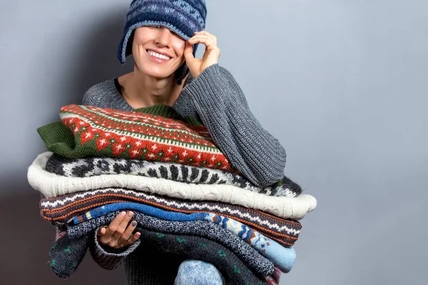 Woman Holding Stack Folded Clothes Knitted Sweaters Colorful Pullovers Grey — Stock Photo, Image