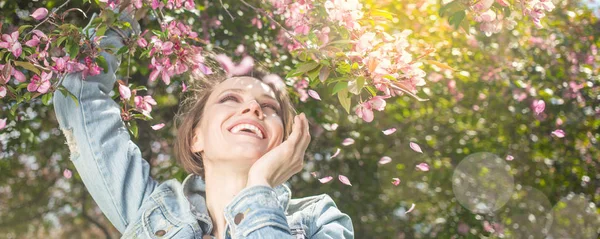 Young happy woman happy smiling enjoying spring summer day