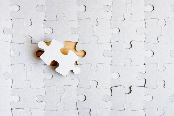 Fill the missing parts fragment of white jigsaw concept puzzle