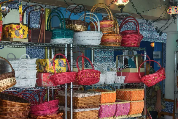 colorful baskets on the counter of the Singapore market