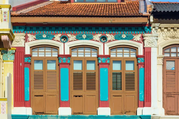 colorful houses with painted Windows and shutters in the historic Little India quarter in Singapore