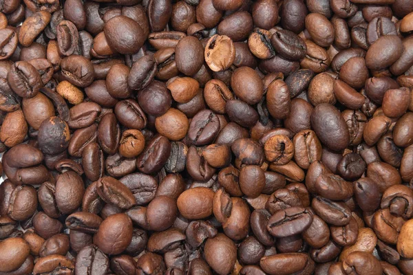 Κόκκοι καφέ ως φόντο, κοντινό. — Φωτογραφία Αρχείου