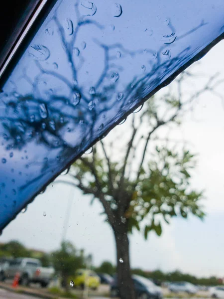 Selected focus drop of water on the glass outside the car after  raining