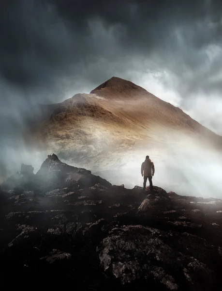 Person Hiking Looks Onwards Mountain Shrouded Mist Clouds Peak Visible — Stock Photo, Image