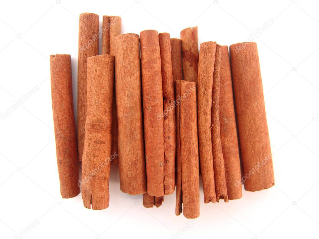 group of cinnamon sticks isolated over white