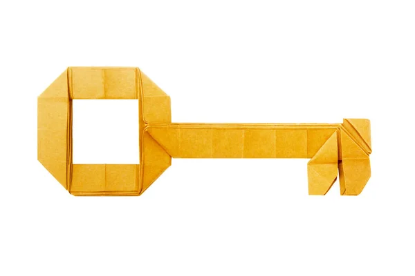 Papel en origami llave dorada sobre fondo blanco —  Fotos de Stock