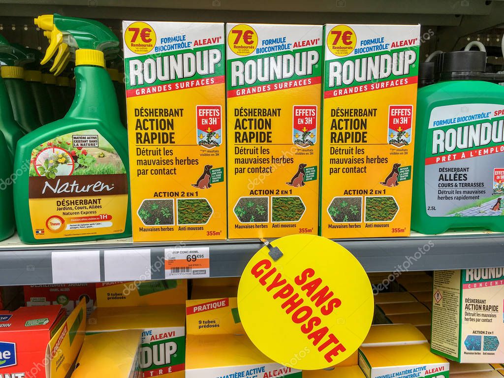 Paris, France - April 27, 2019 : Shelves with a variety of Herbicides in a french Hypermarket. Roundup is a brand-name of an herbicide containing glyphosate, made by Monsanto Company.