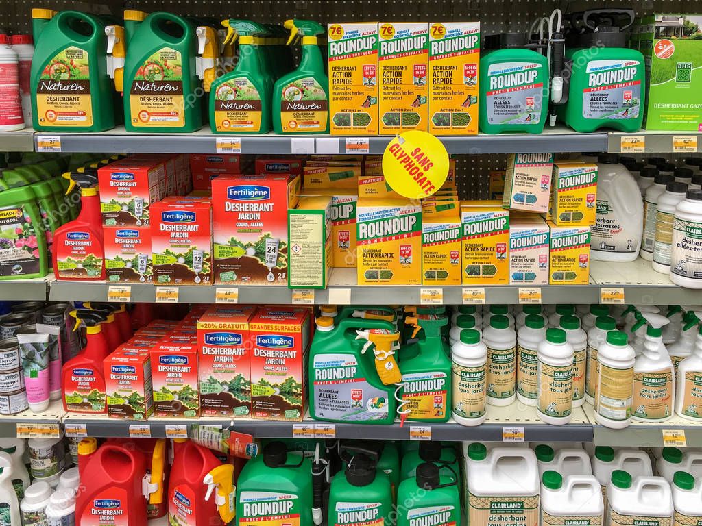 Paris, France - April 27, 2019 : Shelves with a variety of Herbicides in a french Hypermarket. Roundup is a brand-name of an herbicide containing glyphosate, made by Monsanto Company.